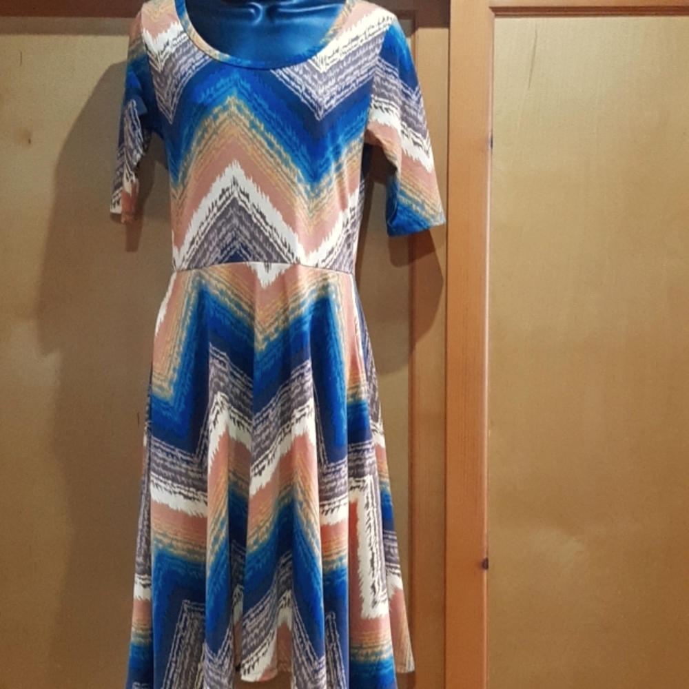 Lularoe dress size Medium in shades of brown, orange, brown and tan.